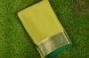 Picture of Olive Green and Bottle Green Pure Mysore Crepe Silk Saree with Plain Body and Zari Woven Border